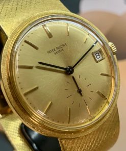 Patek Philippe Calatrava in 18k Yellow gold  on an 18 K PP integrated bracelet, Champagne dial Ref. 3445/6  Serial #  324.831 Ca. 1968 Archive Extract, 6 month EWG Warranty .