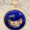Pocket watch, 15ct gold case set with seed pearls, enamelled seen of a sailing boat and fisherman sitting on the wharf, Ca 1870.