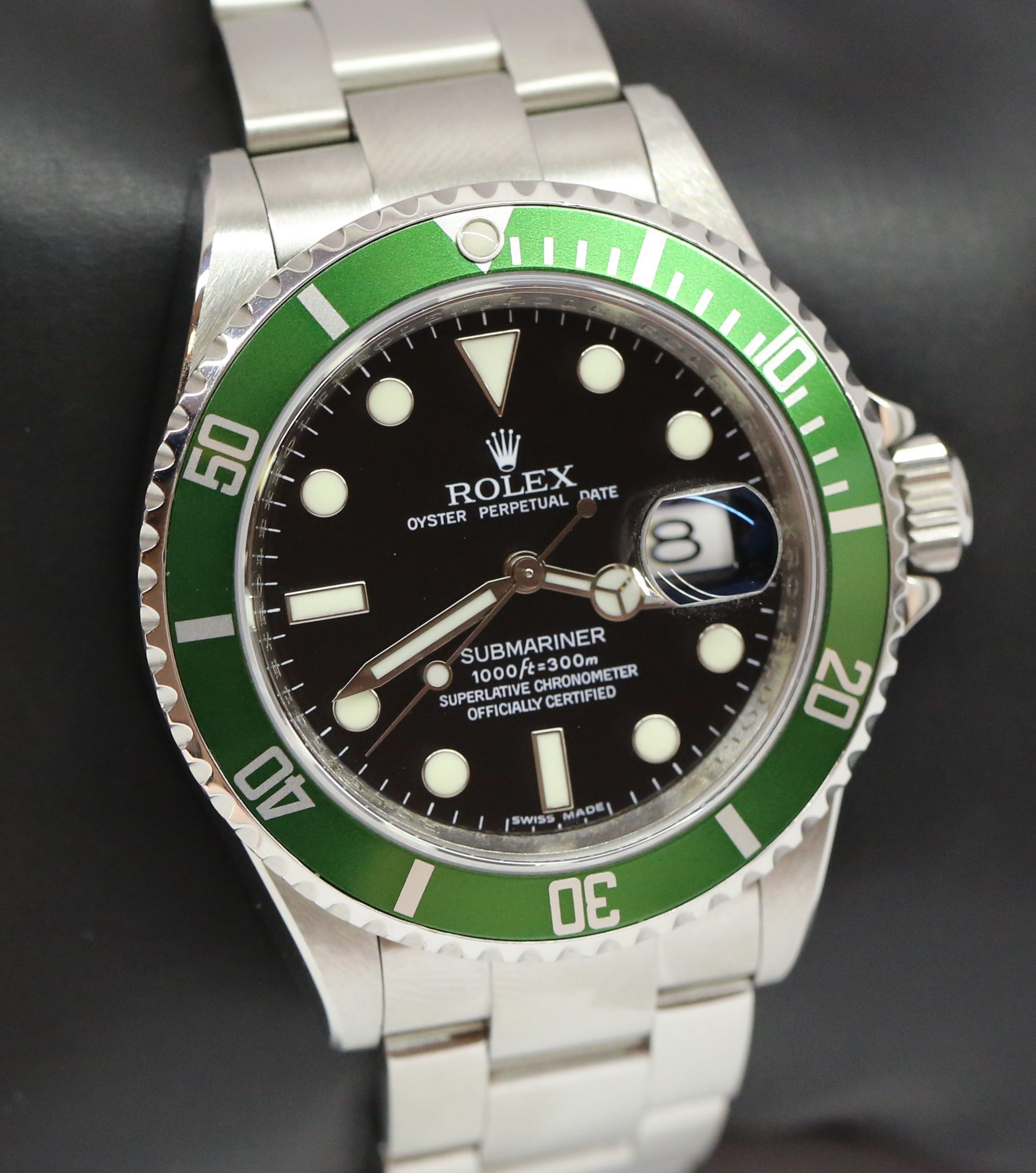 Rolex Submariner Date "Kermit". Green bezel and black index dial. Stainless steel case and Rolex Oyster Bracelet, Ref: 16610LV, M Serial circa: 2008, Engraved Rehaut, with Box & Rolex Service Card