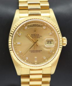 Rolex Oyster Perpetual Day Date in 18ct Yellow Gold on 18ct Yellow Gold Rolex President Bracelet, reference: 18038, Champagne Diamond Dial, Circa: 1981