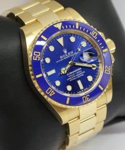 Alternative view of Rolex Submariner Date in 18ct 0.750 yellow gold, sunburst royal blue index dial with a 18ct yellow gold Oyster bracelet. The current 41mm version Ref: 126618LB, Ca. 2021 full set.