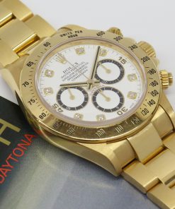 Rolex Daytona Zenith Movement, 18ct Yellow Gold on a Rolex 18ct Yellow Gold Oyster Bracelet, Factory White Diamond Dial, Ref: 16528, Circa: 1990,  with Box, Books & Papers & including a Rolex Service Card.   ” Unpolished”