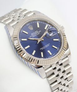 Rolex Oyster Perpetual Datejust 41 in Stainless Steel with 18ct White Gold Fluted Bezel and Blue Index Dial on Rolex Jubilee Bracelet Ref. 126334 Circa: 2019 Complete with Box, Papers and Rolex Service Warranty Card.