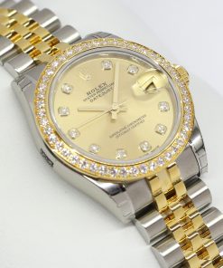 Rolex Oyster Perpetual Datejust 31 in Steel and Gold with Factory Diamond Bezel, Champagne Diamond Index Dial with Rolex Steel and Gold Jubilee Bracelet. Ref. 178383 Serial: 9565E887 Sold New: 2017 Complete with Box, Papers and Balance of Rolex Wty.
