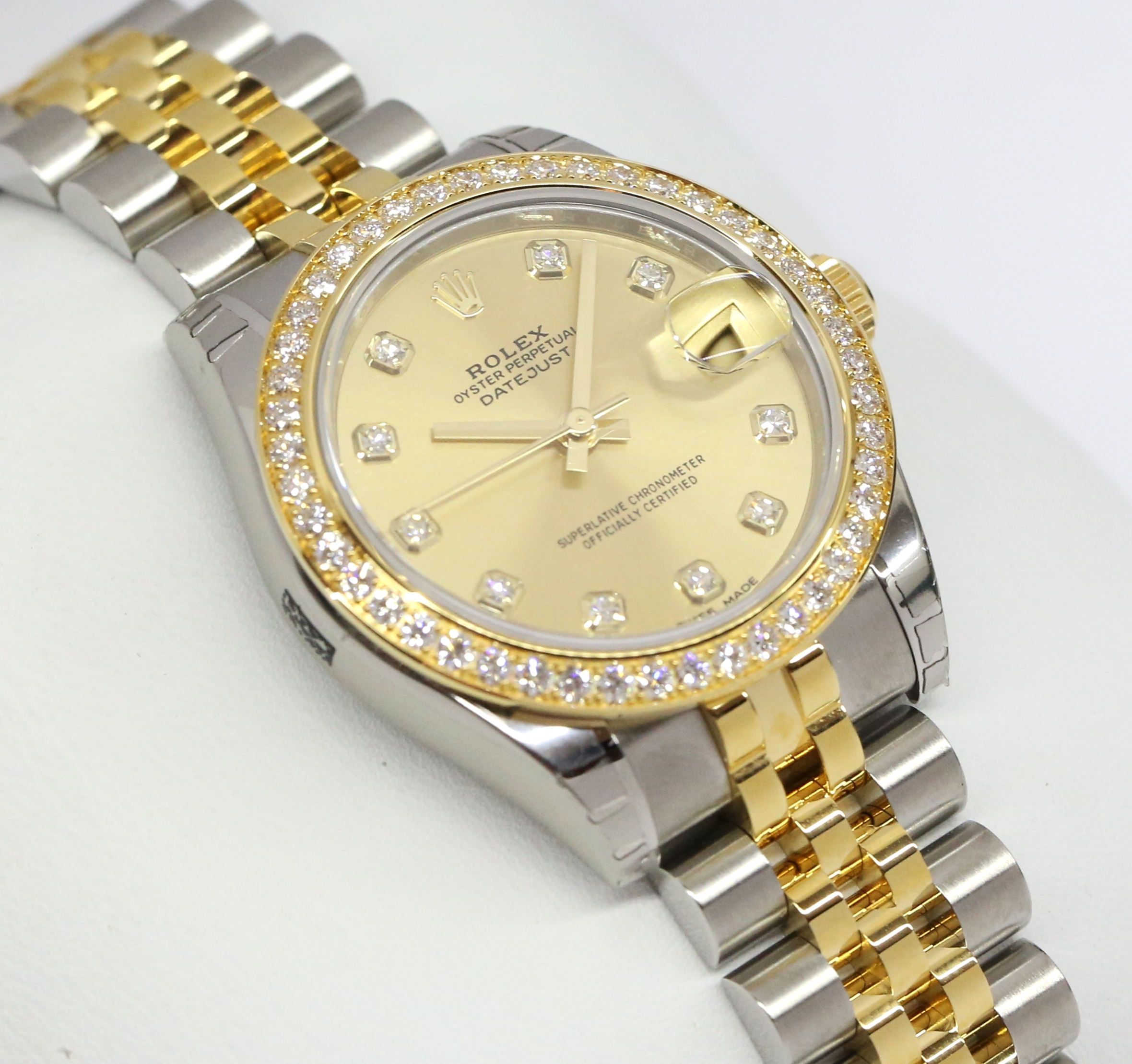 Rolex Oyster Perpetual Datejust 31 in Steel and Gold with Factory Diamond Bezel, Champagne Diamond Index Dial with Rolex Steel and Gold Jubilee Bracelet. Ref. 178383 Serial: 9565E887 Sold New: 2017 Complete with Box, Papers and Balance of Rolex Wty.