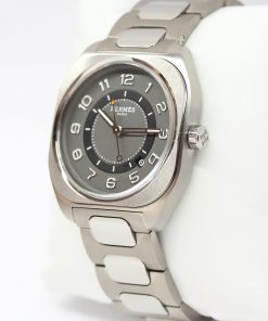 Alternative view of HERMÈS, H08 watch in Titanium, Gray / Black arab dial on a integrated titanium bracelet box and books, Ref: SP1.741,  Circa: 2021
