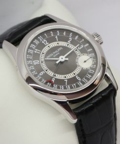 Patek Philippe Calatrava in 18ct White Gold,  Pointer Date on Strap with Black Dial Ref. 6000G-010 Circa: 2007 Complete with Box and Papers Just returned from Patek Philippe Service