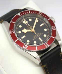 Tudor Heritage Black Bay in Stainless Steel dive watch, Black index dial and Red bezel on a Tudor Strap with Tudor Stainless Steel Deployant Clasp, Ref 79230R, Complete with Box and Papers, Ca. 11/2020