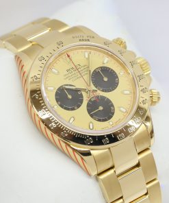 Rolex Oyster Perpetual Cosmograph Daytona in 18ct Yellow Gold with Champagne Dial with Black Sub Dials on 18ct Yellow Gold Rolex Oyster Bracelet Ref. 116528 Circa: 2002 Complete with Box and RSC Warranty Card.