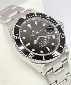 Rolex Submariner Date in stainless steel, Black index dial, Black 60min Bezel on a Rolex Oyster Fliplock Bracelet, Complete with Box, books, swing tags and Rolex Warranty Paper,Ca 2003