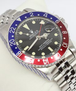 Rolex GMT Master in Stainless Steel, Matte Black Tritium Index Dial on Rolex Folded Link Jubilee Bracelet, Reference 1675, Circa: 1976, Just Serviced By Rolex, Comes with Box & Service Card