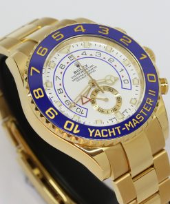 Rolex Yachtmaster II 44mm in 18ct yellow gold, White index dial, Blue ceramic bezel on a Rolex 18ct Yellow gold Oyster bracelet. Box and Papers Ca. 2018