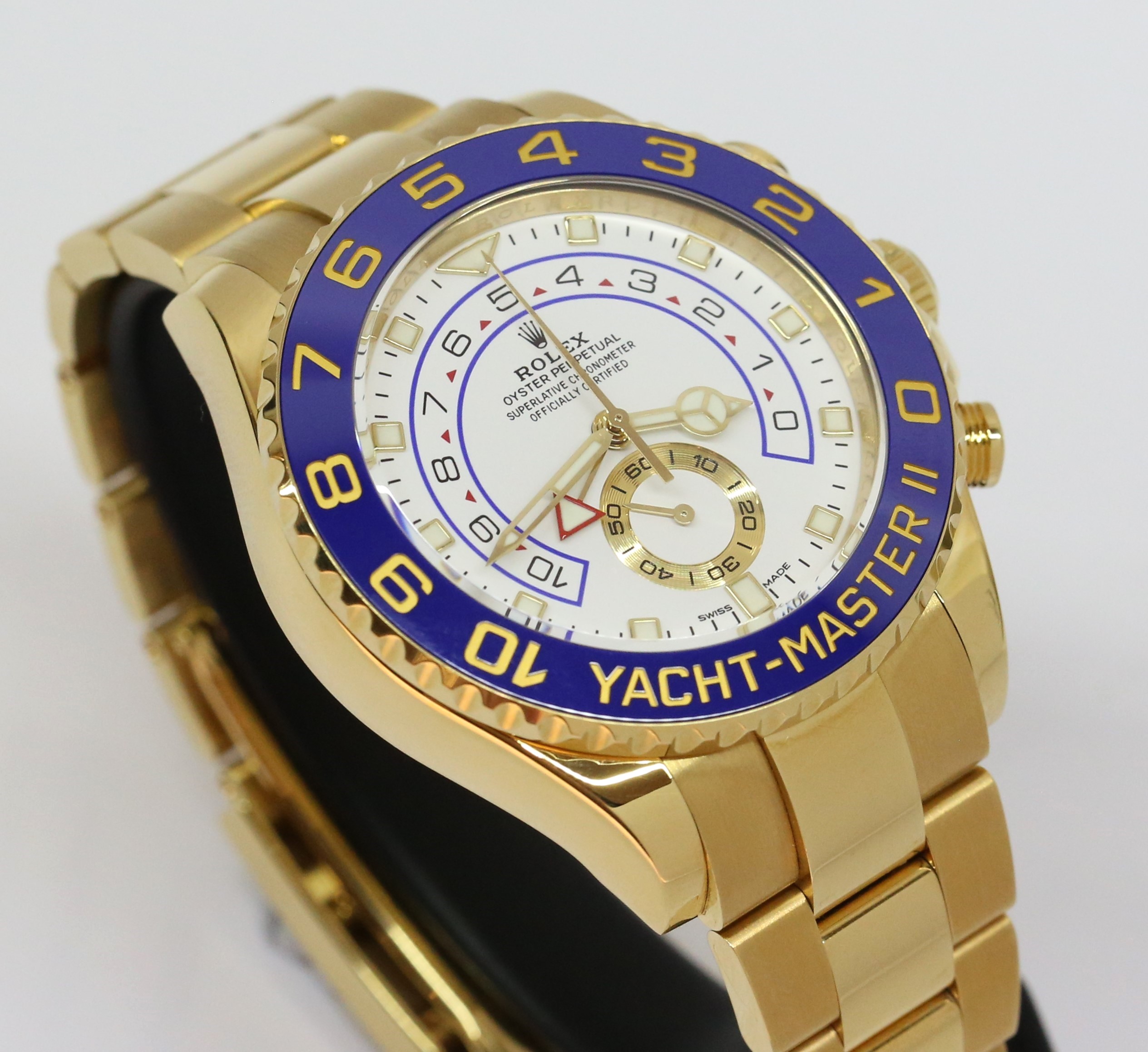 Rolex Yachtmaster II 44mm in 18ct yellow gold, White index dial, Blue ceramic bezel on a Rolex 18ct Yellow gold Oyster bracelet. Box and Papers Ca. 2018