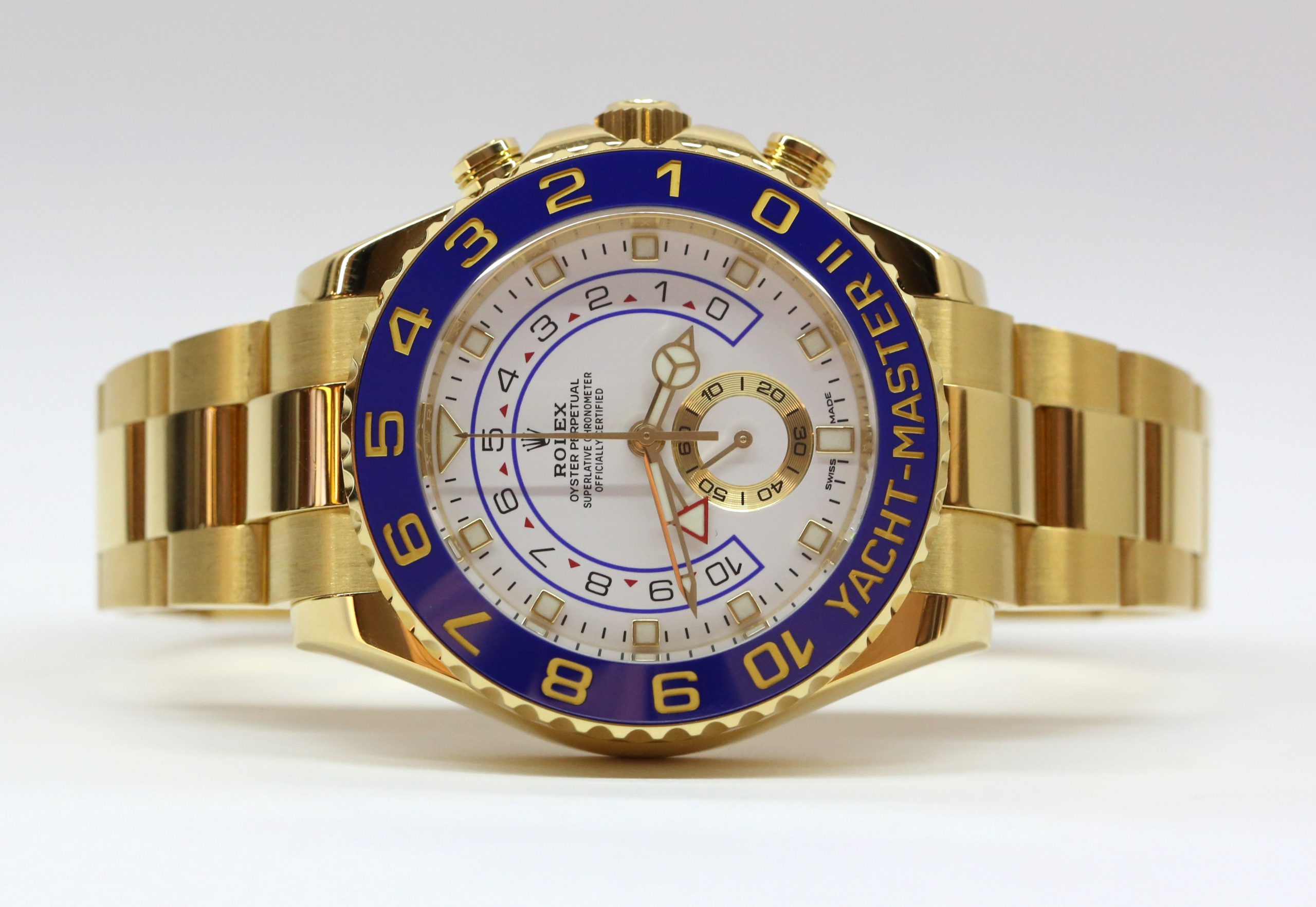 Rolex Yachtmaster II 44mm in 18ct yellow gold, White index dial, Blue ceramic bezel on a Rolex 18ct Yellow gold Oyster bracelet. Box and Papers Ca. 2018 - Image 3