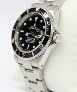 Alternative view of Rolex Submariner Date in stainless steel, Black index dial, Black 60min Bezel on a Rolex Oyster Fliplock Bracelet, Complete with Box, books, swing tags and Rolex Warranty Paper,Ca 2003