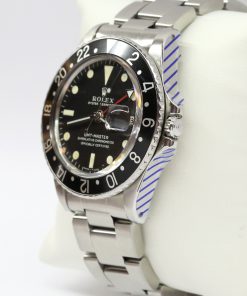 Alternative view of Rolex GMT Master, Stainless Steel, Black Bezel, Matte Black Tritium Index Dial on Rolex Oyster Bracelet, Reference 1675, Circa: 1969, with Box & Rolex Service Card
