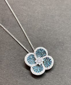 Poniros 18ct white gold diamond pendant, set with total of 0.69ct brilliant cut white diamonds & brilliant cut treated blue diamonds.