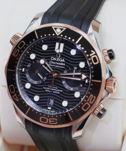 Alternative view of Omega Seamaster Diver 300M Co-Axial Master Chronometer Chronograph in Steel - Sedna Gold on Rubber strap, black ceramic bezel, Box and books, under Omega Factory Warranty Ca. 2022