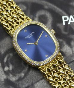 Patek Philippe Ladies Ellipse 18ct Yellow Gold, Blue Diamond dial and Diamond bezel on a Patek Philippe 18ct integrated Bracelet.  Ref: 4698/001 Ca. 1995 with Papers