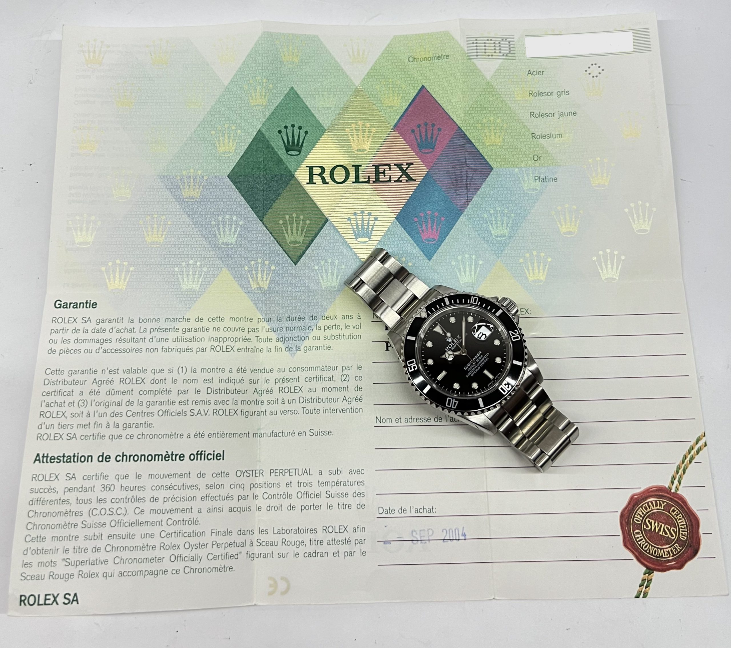 Rolex Submariner Date in Stainless Steel on Rolex Stainless steel Flip lock Oyster Bracelet, Black Index Dial, Complete with the Inner & Outer box, Rolex Warranty certificate and swing tags. Reference: 16610, Circa 2004 - Image 8