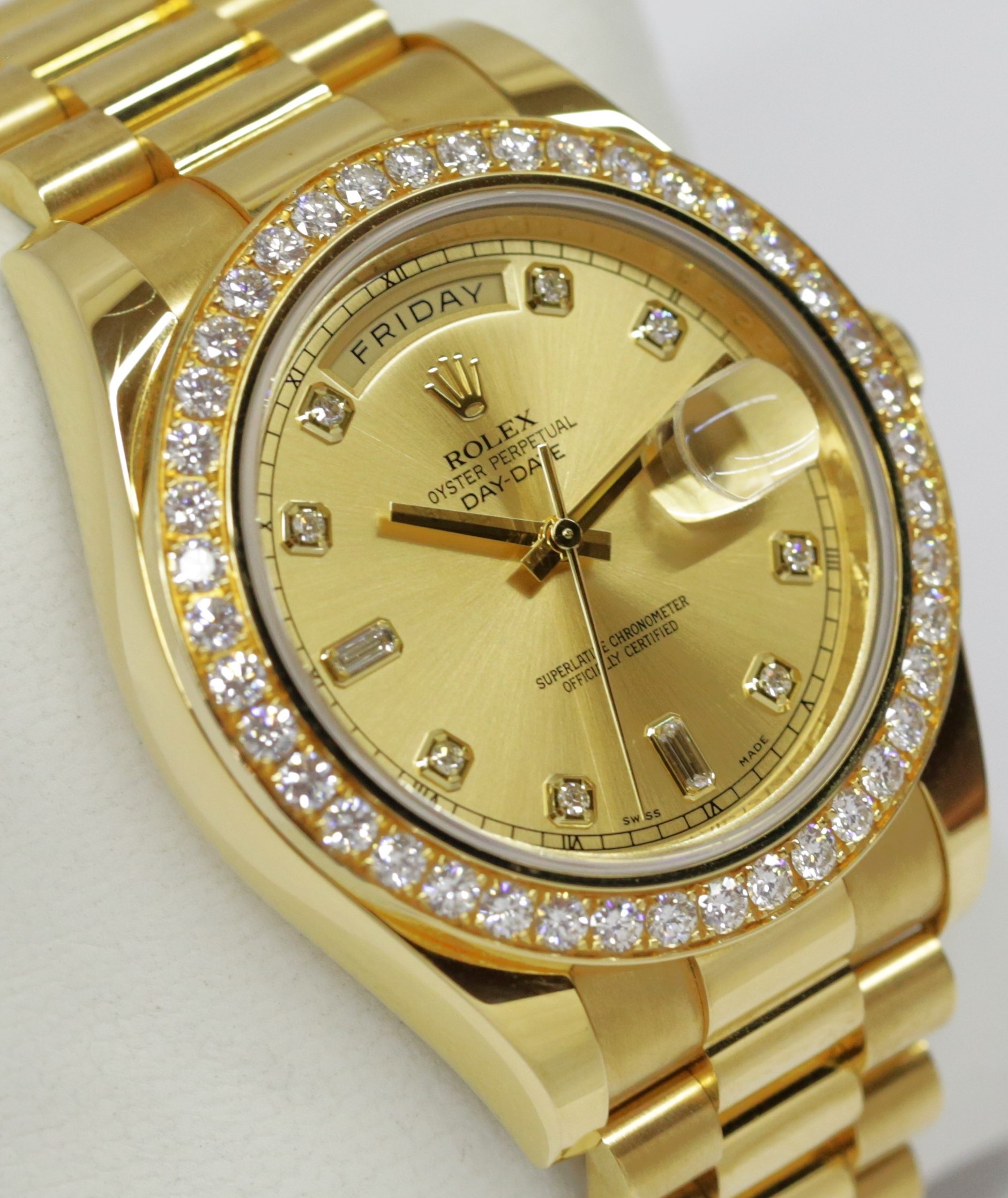 Rolex Oyster Perpetual Day-Date II in 18ct Yellow Gold on a 18ct Yellow Gold President Bracelet, Champagne diamond dial and factory Diamond bezel , Reference: 218348, Ca. 2010, complete with box, book and Rolex Warraty card.