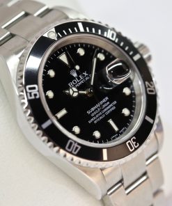 Rolex Submariner Date in Stainless Steel on Rolex Stainless steel Flip lock Oyster Bracelet, Black Index Dial, Complete with the Inner & Outer box, Rolex Warranty certificate and swing tags. Reference: 16610, Circa 2004