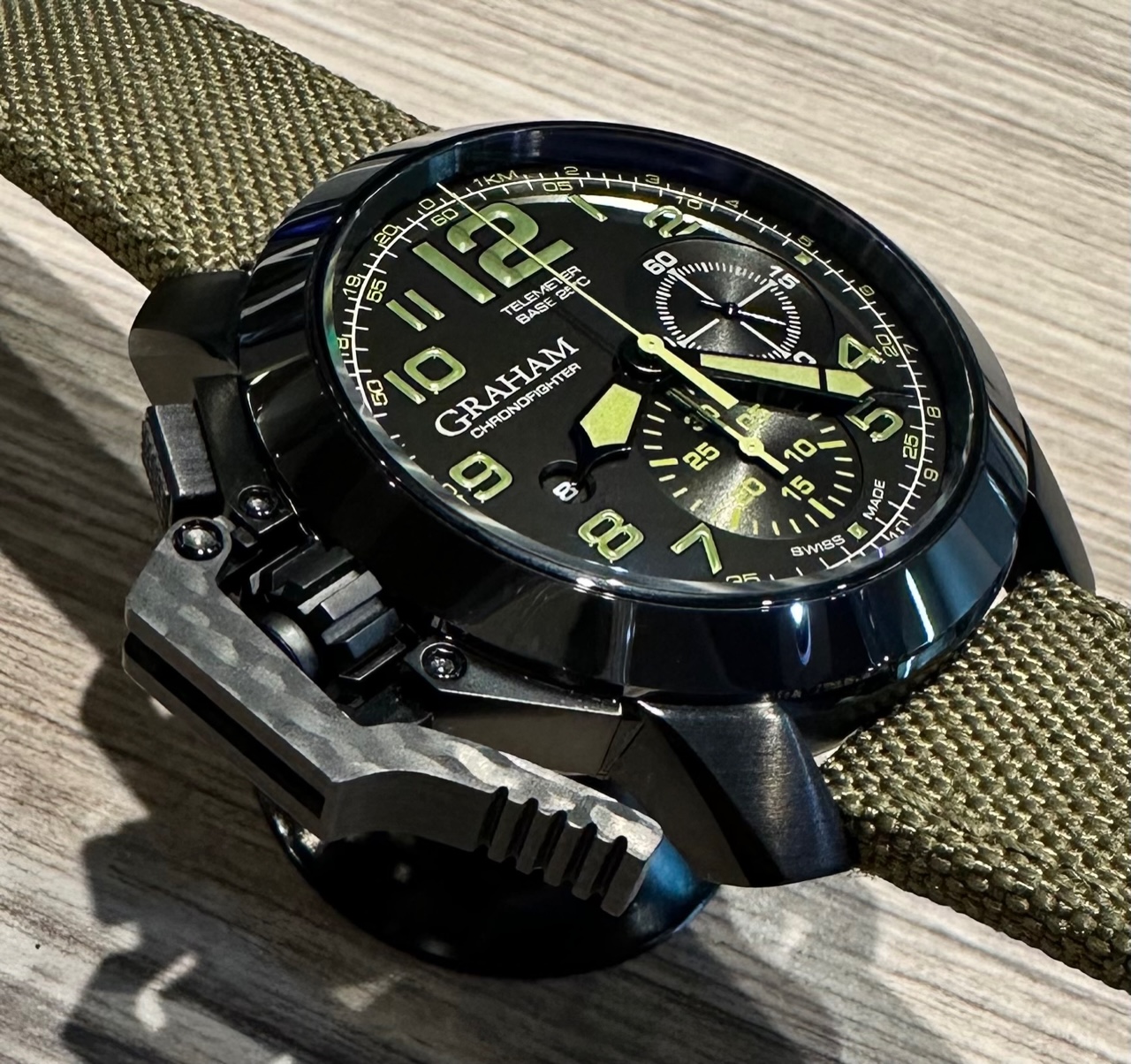 Graham Chronofigher Oversize, Black DLC Coated Stainless Steel, with Black Dial with Green Arab Numerals, on Green Graham Textile Strap with Graham Tang Buckle, Ref. 2CCAU, Complete with Box & Book