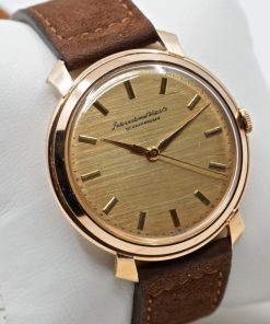 IWC wristwatch in 18ct rose gold, Flared Lugs, Rare gold textured Dial, Manual winding, Calibre 89, 37mm case on brown suede strap