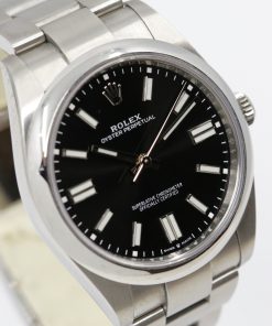 Rolex Oyster Perpetual 41 Ref 124300, with Bright Black dial, 2022, box and papers.