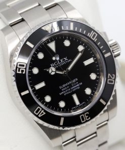 Rolex Submariner Non-Date, Stainless Steel, Black Index Dial & Black Ceramic Bezel, on Stainless Steel Rolex Oyster Bracelet, Ref.114060, Circa: 2014, Complete with Box, Book & Rolex Warranty Card