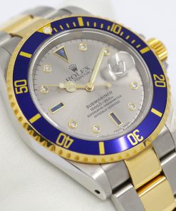 Rolex Oyster Perpetual Submariner Date, Stainless Steel & 18ct Yellow Gold, "Serti" Silver Dial, on Stainless Steel & 18ct Yellow Gold Rolex Oyster Bracelet, Ref.16613, Circa: 2001, with Box, Book & Rolex Warranty Cerifiticate