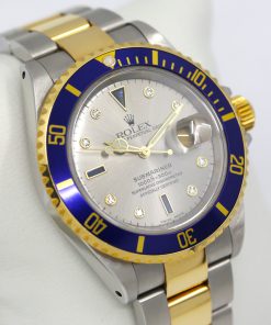 Alternative view of Rolex Oyster Perpetual Submariner Date, Stainless Steel & 18ct Yellow Gold, "Serti" Silver Dial, on Stainless Steel & 18ct Yellow Gold Rolex Oyster Bracelet, Ref.16613, Circa: 2001, with Box, Book & Rolex Warranty Cerifiticate