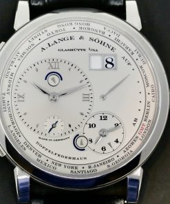 A. Lange & Sohne Lange 1 Time Zone in Platinum, Silver Roman Dial, on Black A. Lange & Sohne Alligator Strap with Platinum A. Lange & Sohne Tang Buckle, Complete with Box & Book