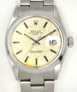 Rolex Oyster Perpetual Date, in Stainless Steel, Linen patina Dial, on Stainless Rolex Oyster Bracelet, Ref. 1500, Circa: 1970