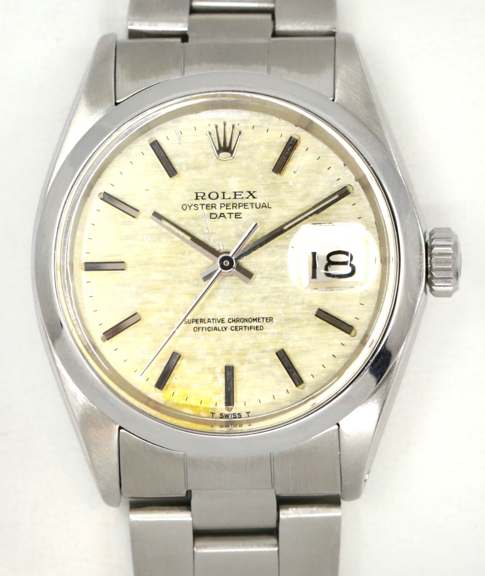 Rolex Oyster Perpetual Date, in Stainless Steel, Linen patina Dial, on Stainless Rolex Oyster Bracelet, Ref. 1500, Circa: 1970