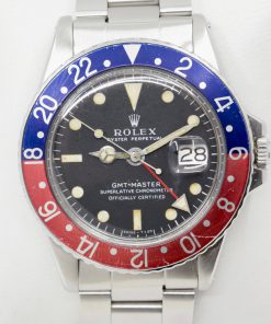 Rolex Oyster Perpetual GMT-Master, Stainless Steel, Matte Black "Swiss - T <25", Blue & Red Bezel, on Stainless Steel Rolex Oyster Bracelet, Ref. 1675, Circa: 1971