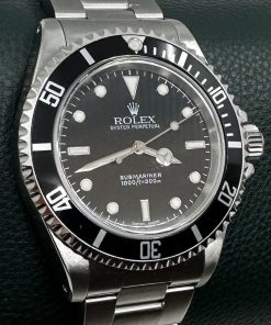 Rolex Oyster Perpetual Submariner Ref 14060M, Y series 2002 series sold new in Japan March 2003, box and papers.