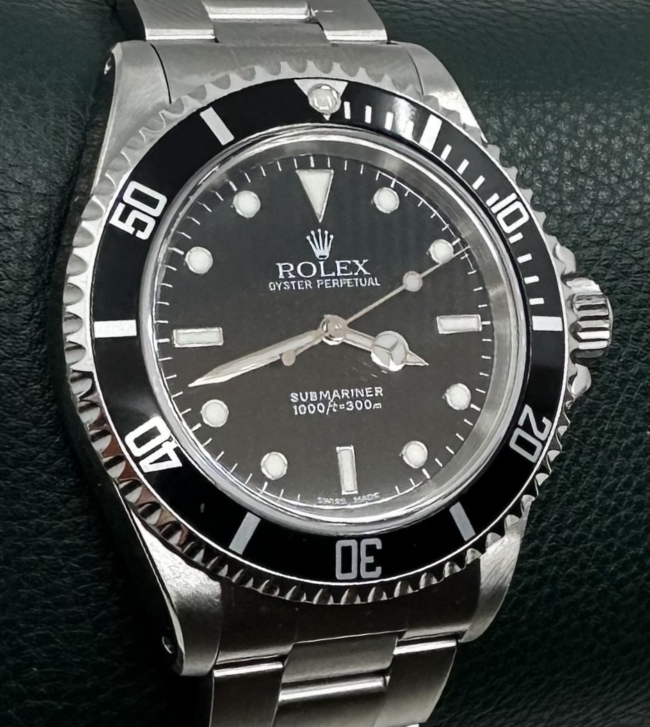 Rolex Oyster Perpetual Submariner Ref 14060M, Y series 2002 series sold new in Japan March 2003, box and papers.