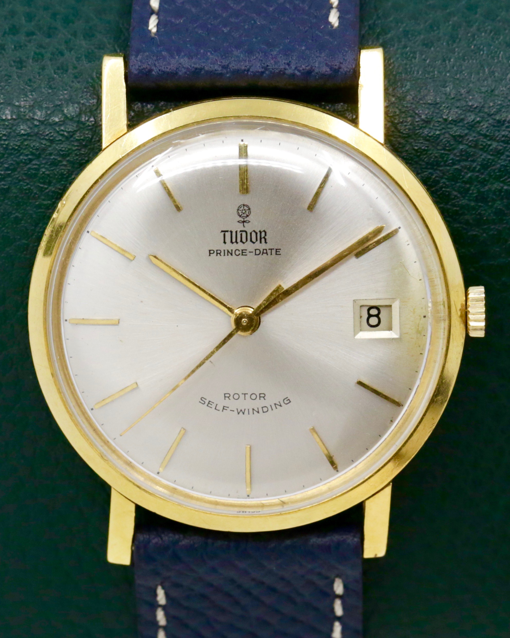 Tudor Prince Date, Ref. 1980, Rotor Self- Winding, in 18ct Yellow Gold, Silver Index Dial, on Navy Blue Leather Strap, Circa: 1966