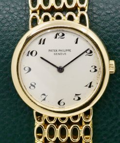 Patek Philippe Ladies Dress Watch, in 18ct Yellow Gold, Silver Dial with Breguet Numerals, on 18ct Yellow Gold Patek Philippe Integrated Bracelet, Ref. 4185/1, Circa: 1970's