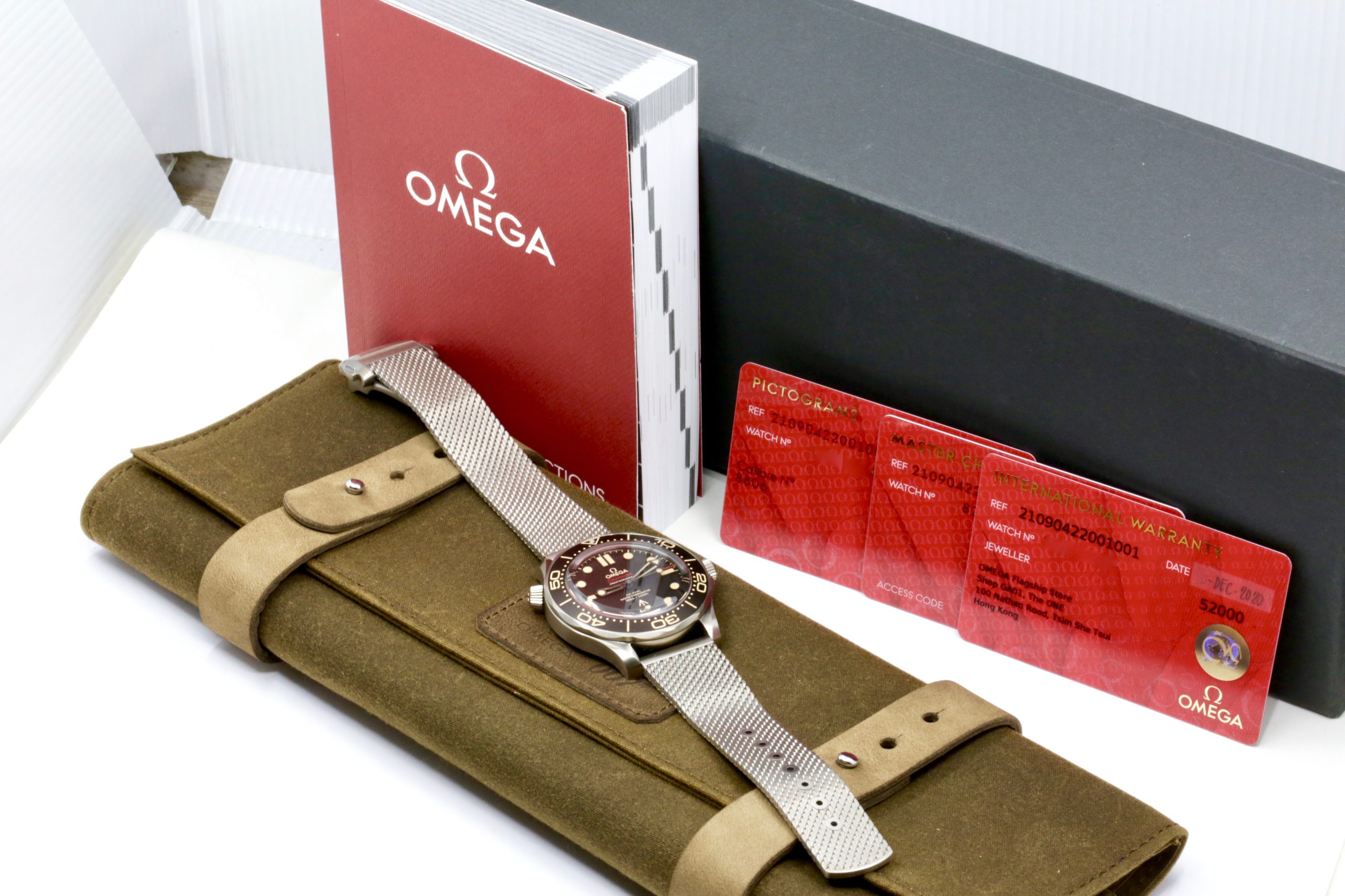 Omega Seamaster 300M, "No Time to Die" 007 Bond Edition, in Titanium, Brown Index Dial, on Titanium Omega Bracelet with Folding Clasp, Ref. 210.90.42.20.01.001, Circa: 2020, Complete with Box, Books, Omega Warranty Card & Balance of 5 Year Omega Warranty - Image 7