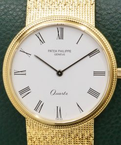 Patek Philippe Ref 3744/001 Calatrava hobnail bezel gents quartz 18K 0.750 yellow gold on original PP bracelet.