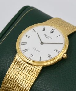 Alternative view of Patek Philippe Ref 3744/001 Calatrava hobnail bezel gents quartz 18K 0.750 yellow gold on original PP bracelet.