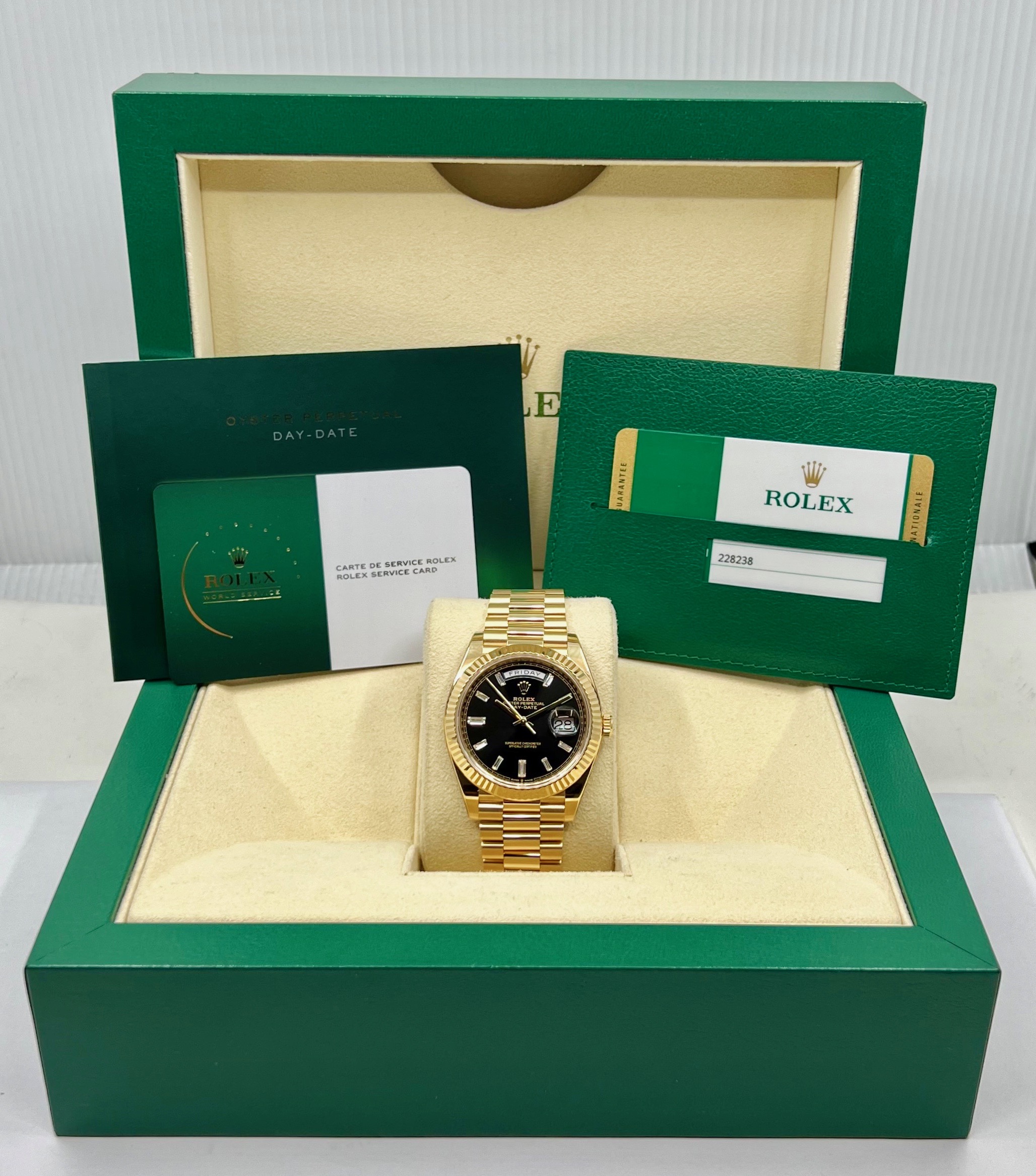 Rolex Day-Date 40, in 18ct Yellow Gold, Black Dial with Factory Set Baguette Diamond Hour Markers, on 18ct Yellow Gold Rolex President Bracelet, Ref. 228238, Circa: 2019, with Box, Books, Rolex Warranty Card, Rolex Service Card & Balance of 2 Year Rolex Service Warranty - Image 7
