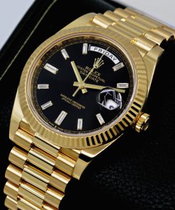 Alternative view of Rolex Day-Date 40, in 18ct Yellow Gold, Black Dial with Factory Set Baguette Diamond Hour Markers, on 18ct Yellow Gold Rolex President Bracelet, Ref. 228238, Circa: 2019, with Box, Books, Rolex Warranty Card, Rolex Service Card & Balance of 2 Year Rolex Service Warranty