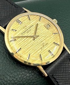 Eterna-Matic 3000 De Luxe gents automatic with date 18K 0.750 yellow gold case, gold bark finish dial, only $990 As Traded!!