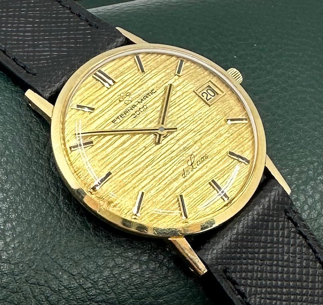 Eterna-Matic 3000 De Luxe gents automatic with date 18K 0.750 yellow gold case, gold bark finish dial, only $990 As Traded!!