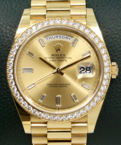 Rolex Day-Date 40, 18ct Yellow Gold, Factory Set Champagne Baguette Diamond Dial & Factory Set Diamond Bezel, on 18ct Yellow Gold Rolex President Bracelet, Ref. 228348RBR, Circa: 2019, Complete with Box, Books, Swing Tags & Rolex Warranty Card
