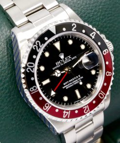 Alternative view of Rolex GMT-Master II "Coke", Stainless Steel, Black Index Dial, Black & Red Bezel, on Stainless Steel Rolex Oyster Bracelet, Ref. 16710, Circa: 1993, Complete with Box, Books, Rolex Warranty Certificate, Rolex Service Card & Balance of 2 Year Rolex Service Warranty