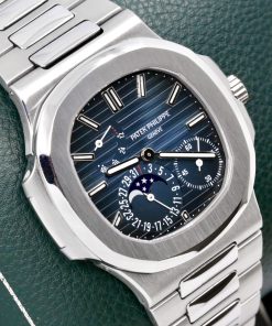 Patek Philippe Nautilus, Stainless Steel, with Date, Moon Phase & Power Reserve Display, on Stainless Steel Patek Philippe Bracelet, Ref. 5712/1A-001, Circa: 2011, with Box, Books, & Patek Philippe Certificate of Origin